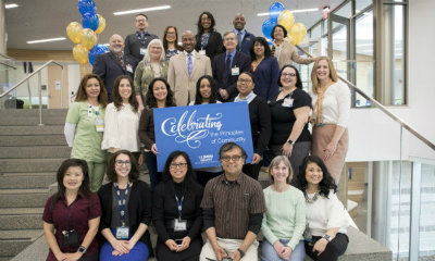 members of the office for health equity diversity and inclusion standing together during principles of community week kickoff